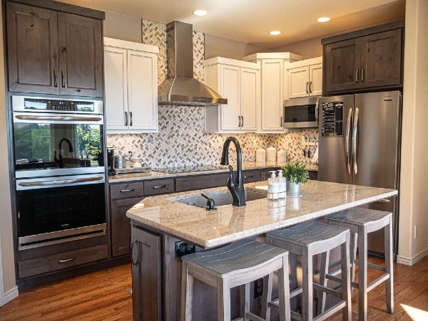 Kitchen remodel white cabinetry tile backsplash 