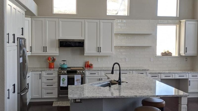 White shaker cabinets subway tile backsplash 